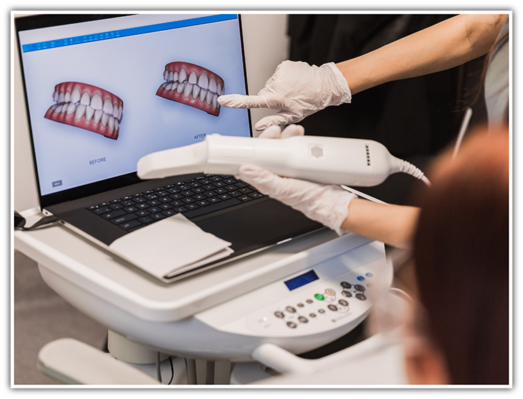 Looking at scans of teeth on monitor