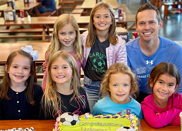Dr. Hinkle with girl's soccer team