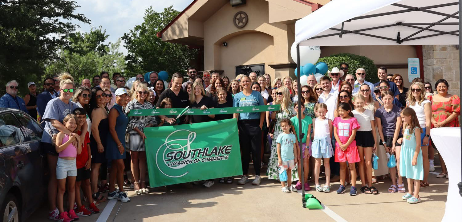 Crowd at ribbon cutting ceremony at dental office