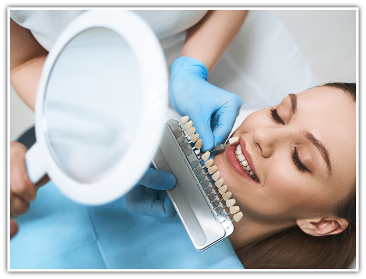 Female patient having teeth shade matched