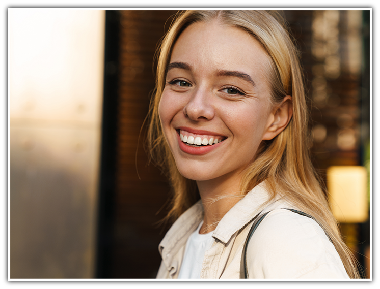 Close-up of blonde woman smiling