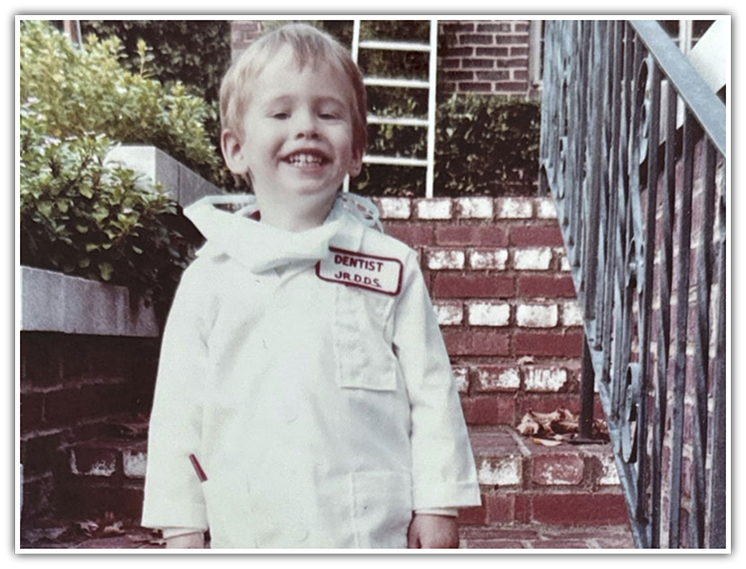 Dr. Hinkle as child in front of house