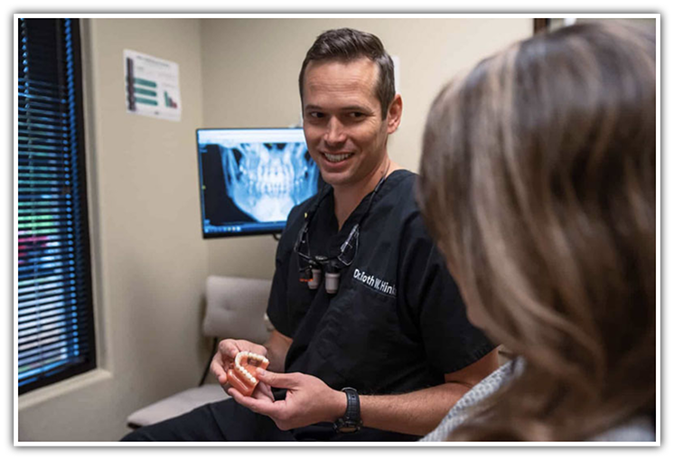Southlake dentist Dr. Hinkle talking with patient