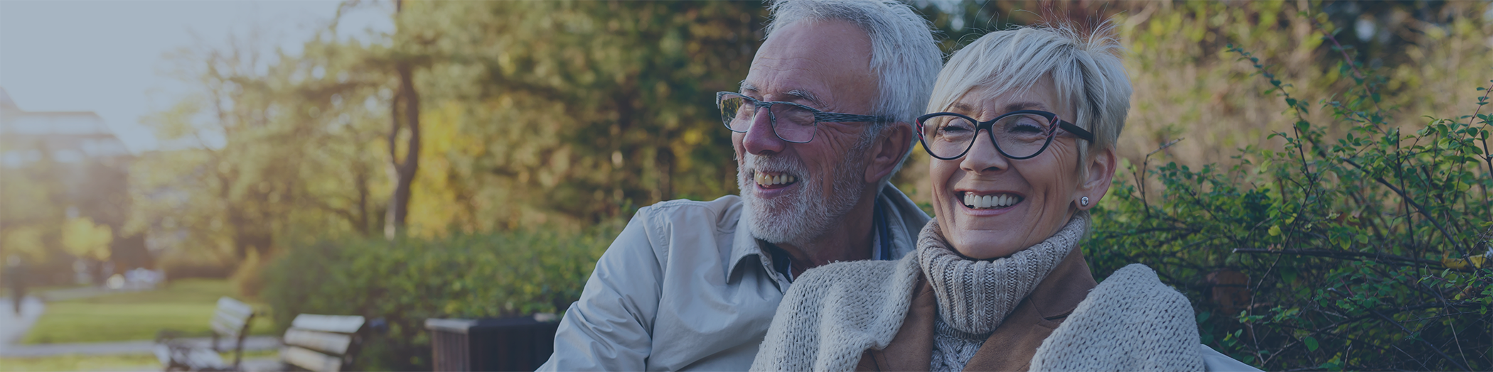 Senior man and woman smiling outside