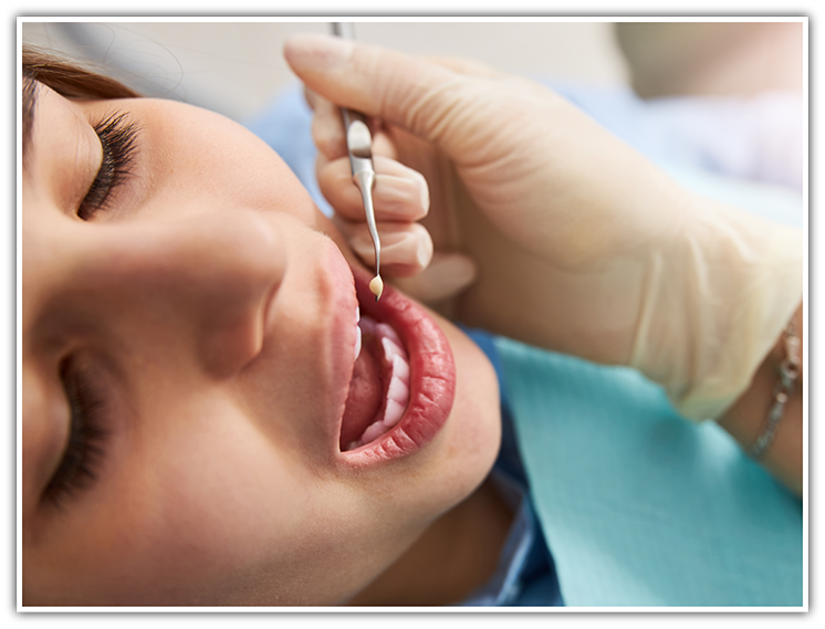 Female patient receiving tooth-colored filling