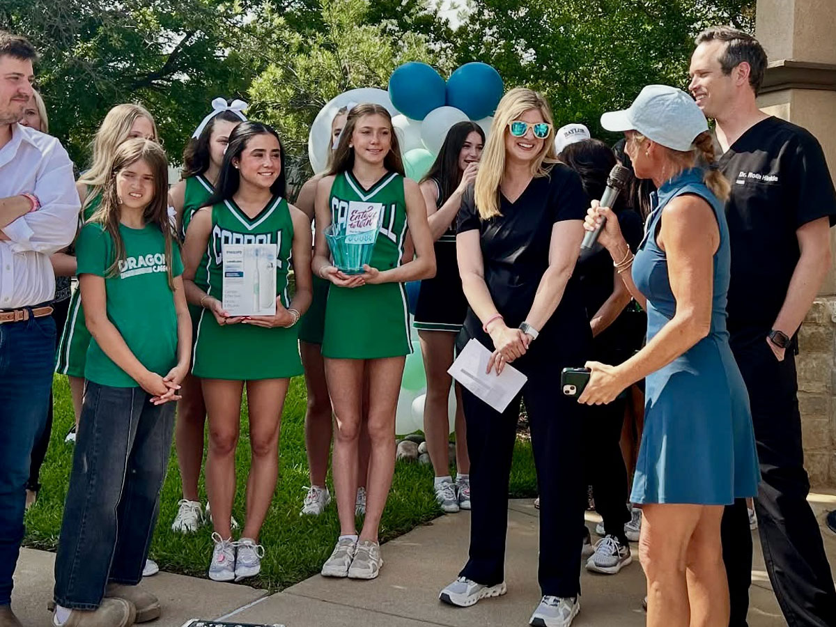 Cheerleaders being interviewed at ribbon cutting