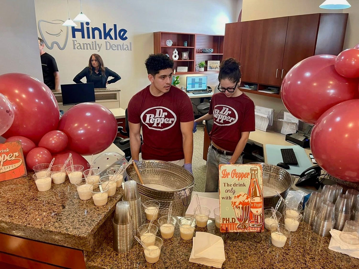 People with Dr. Pepper shirts at table with drinks