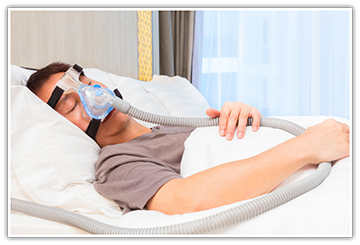 Patient sleeping while hooked up to CPAP machine