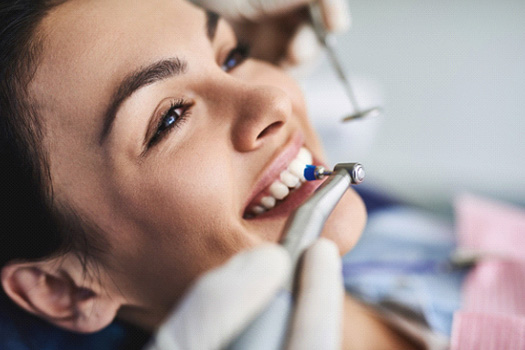 Woman having her teeth cleaned