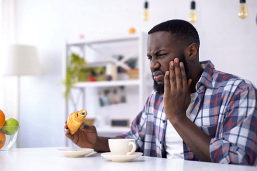 Man with tooth sensitivity