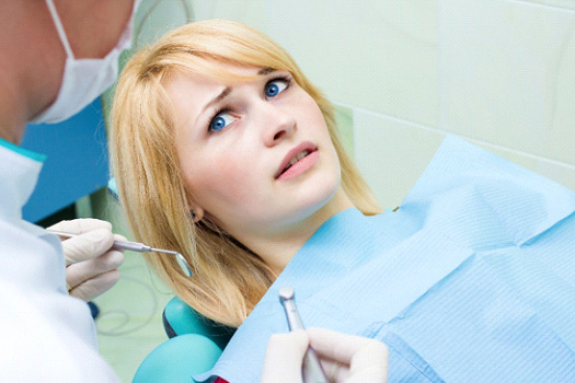 Woman afraid of the dentist