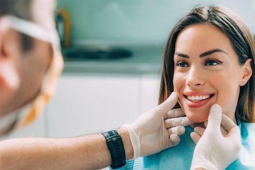Dentist examining a patient’s smile